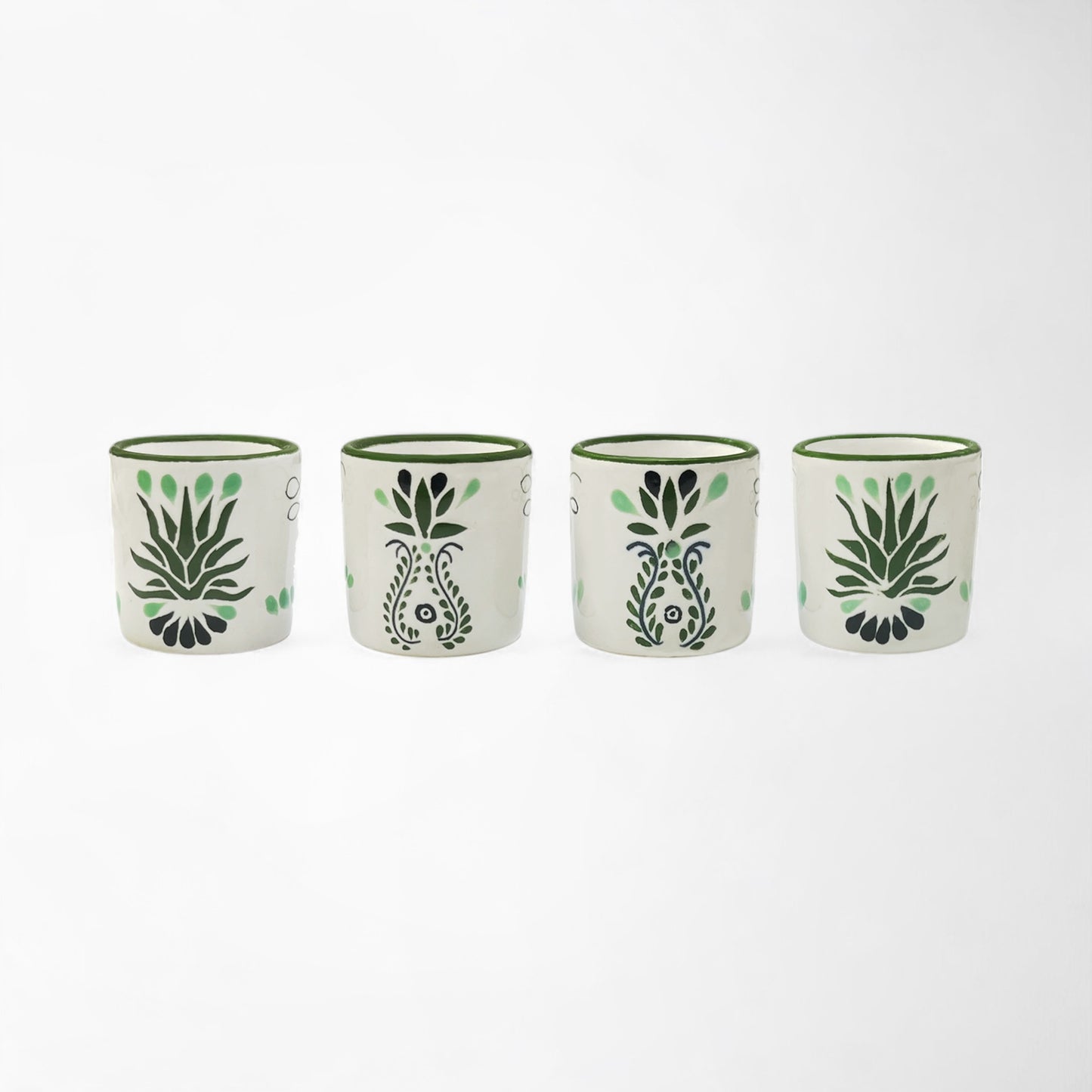 Handcrafted ceramic shot glass set of four, each with unique Talavera detail. Handmade and painted in Mexico