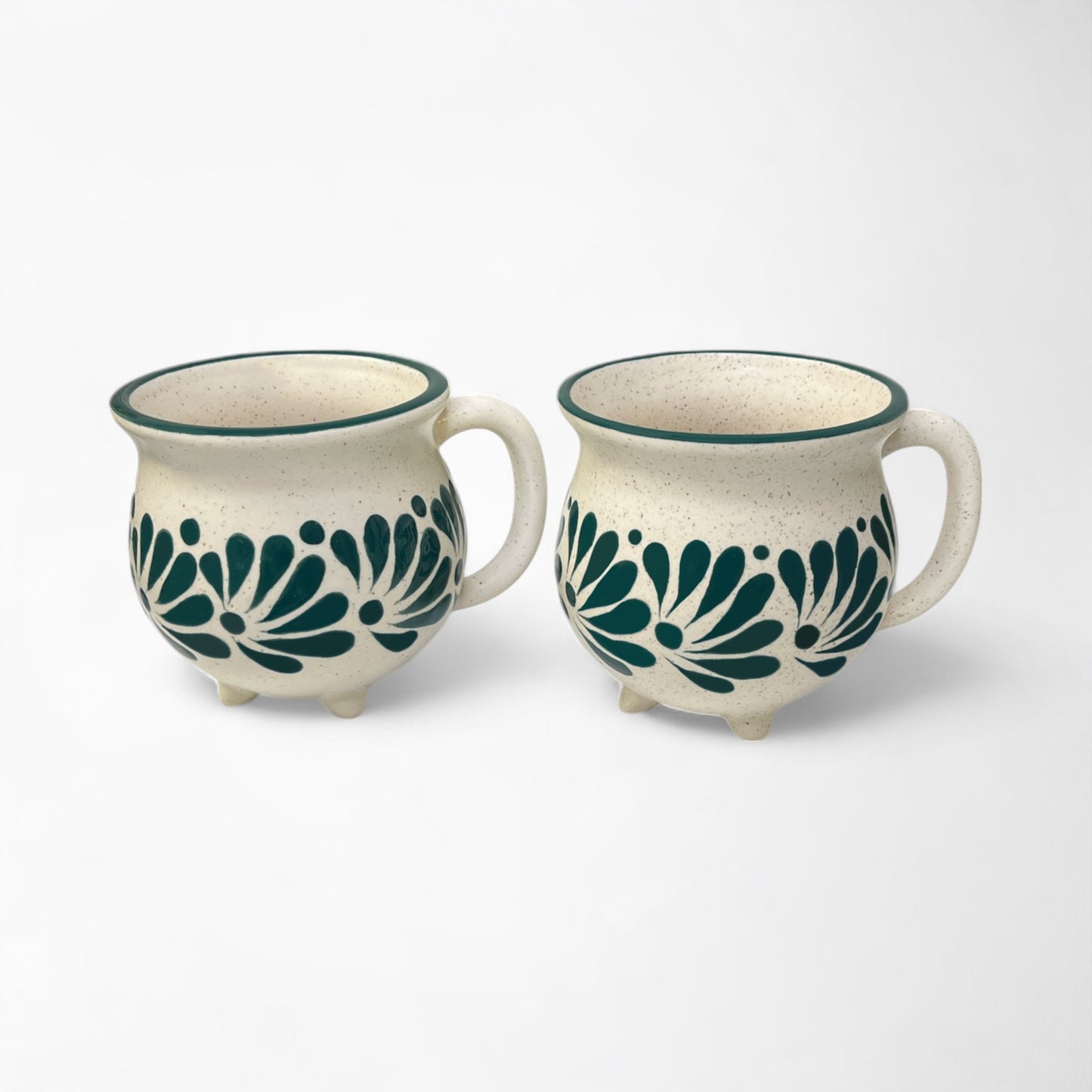Set of hand-painted ceramic mugs combining unique artistry with everyday practicality.
