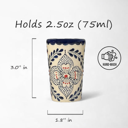 Set of four Mexican Talavera shot glasses, hand-painted with intricate designs in red and blue