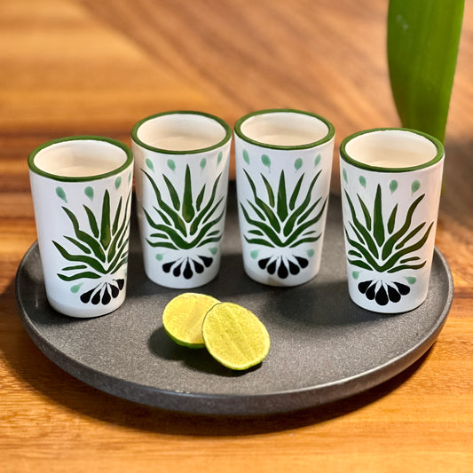Handmade Mexican ceramic shot glass set with vibrant green agave artwork