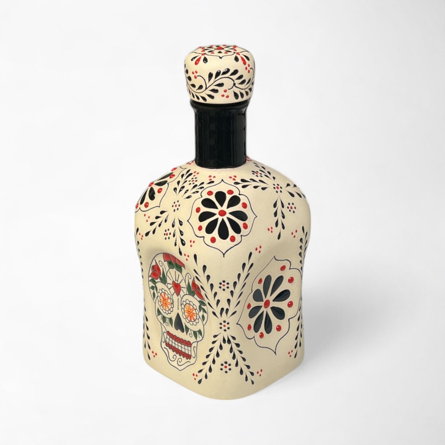 Elegant tequila decanter for home bar or gifting with skull and floral designs.