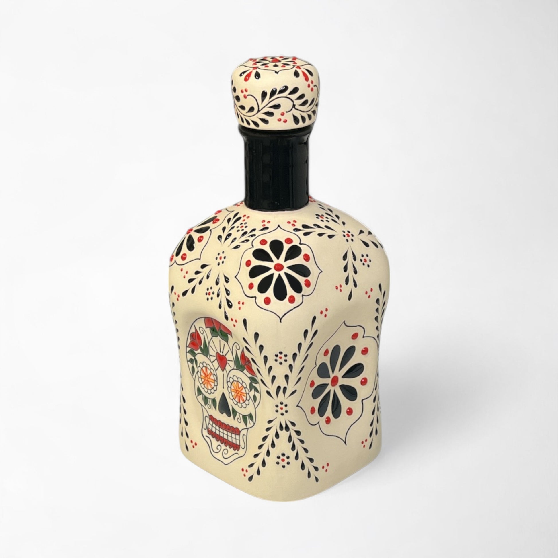 Elegant tequila decanter for home bar or gifting with skull and floral designs.