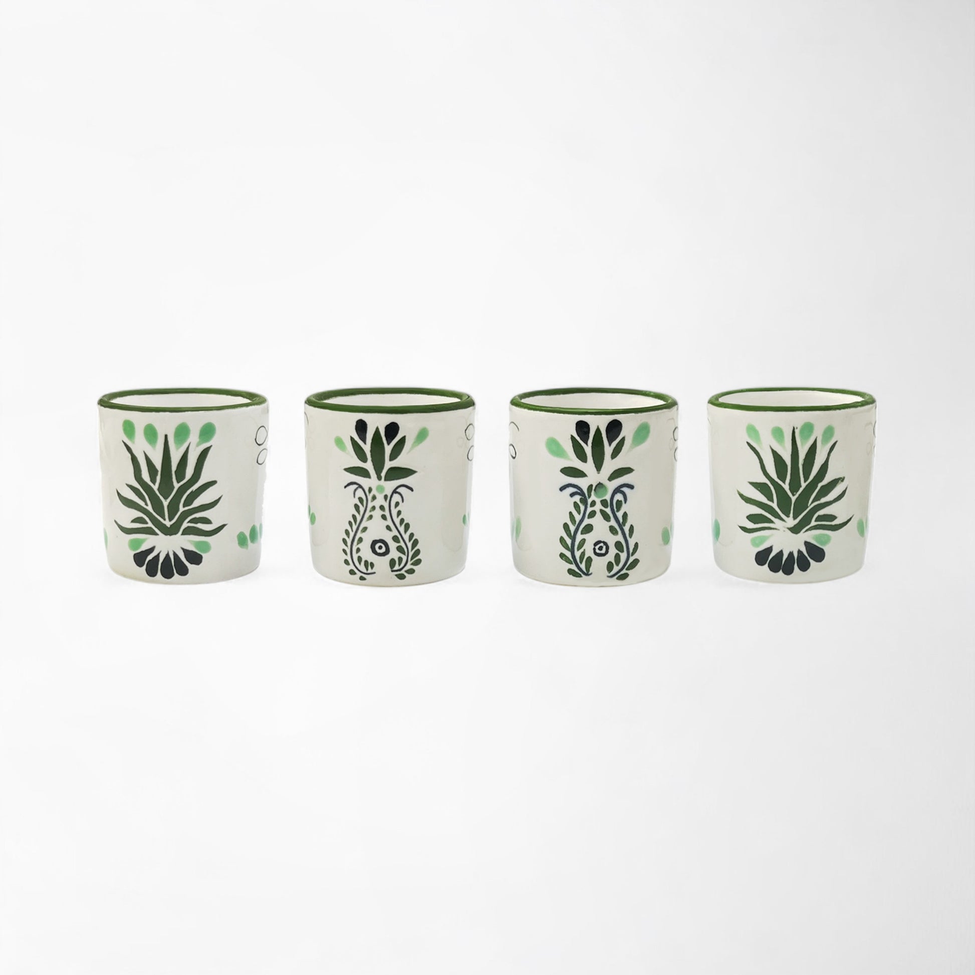 Handcrafted ceramic shot glass set of four, each with unique Talavera detail. Handmade and painted in Mexico