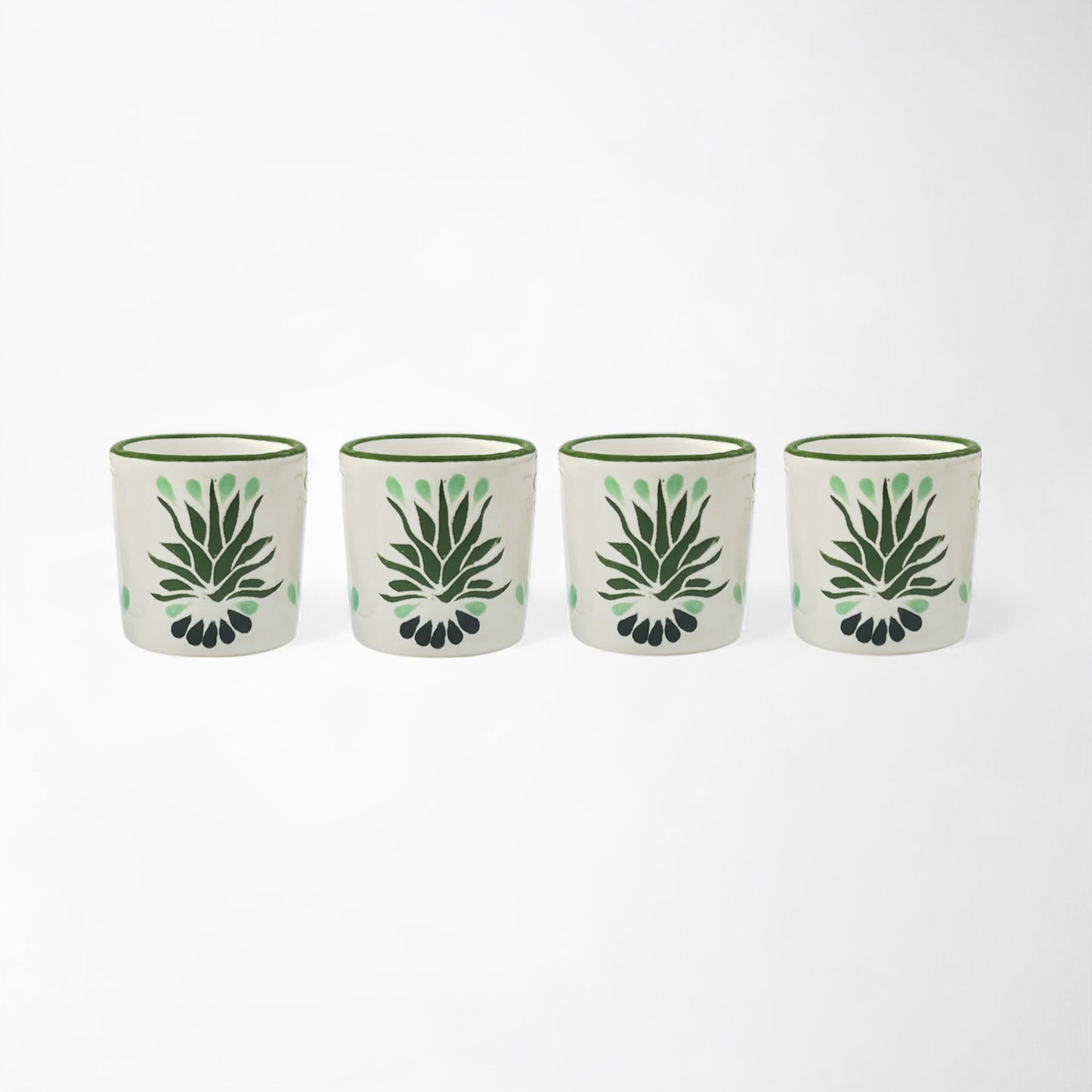 Four piece handmade mezcal shot glass set with traditional agave artwork.