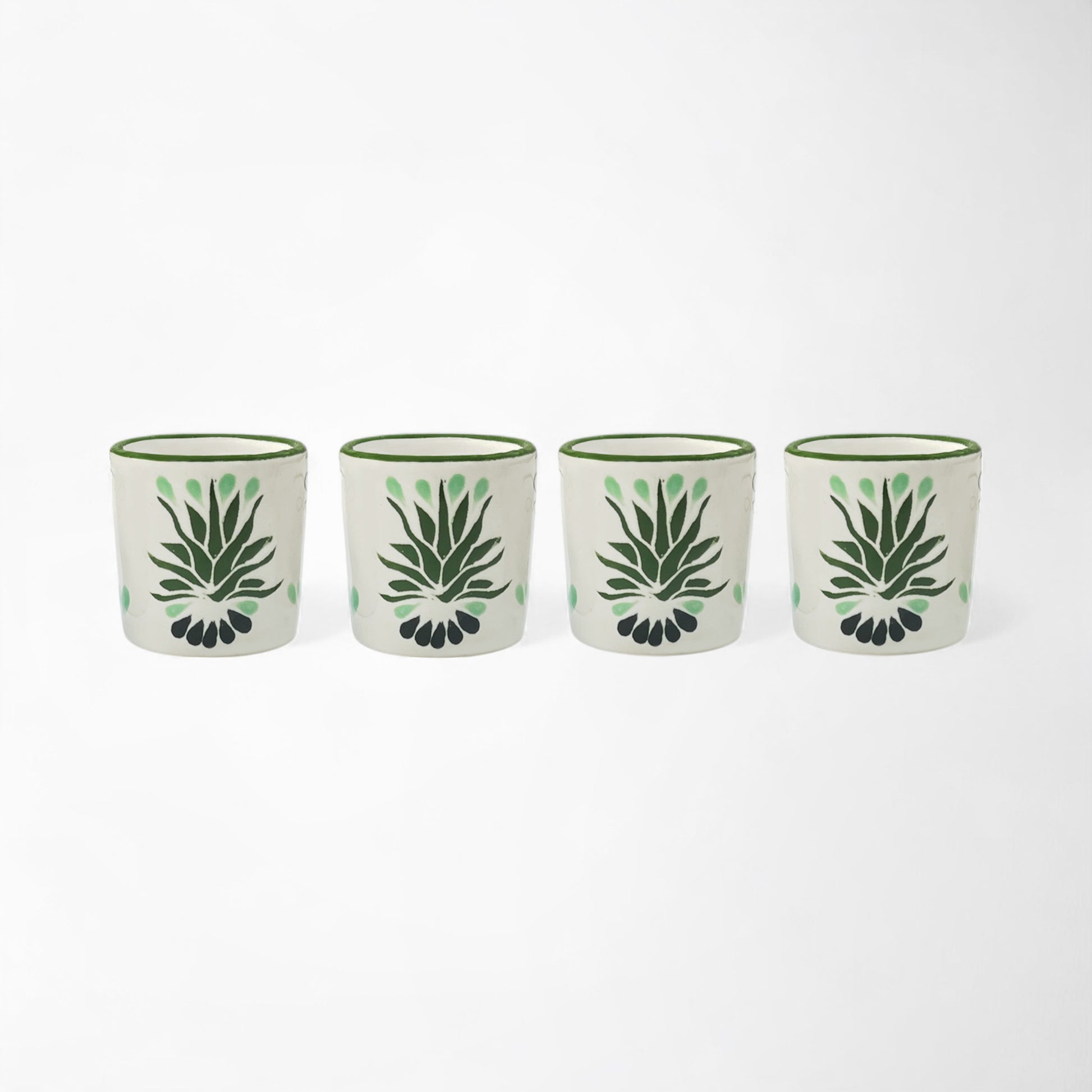 Four piece handmade mezcal shot glass set with traditional agave artwork.