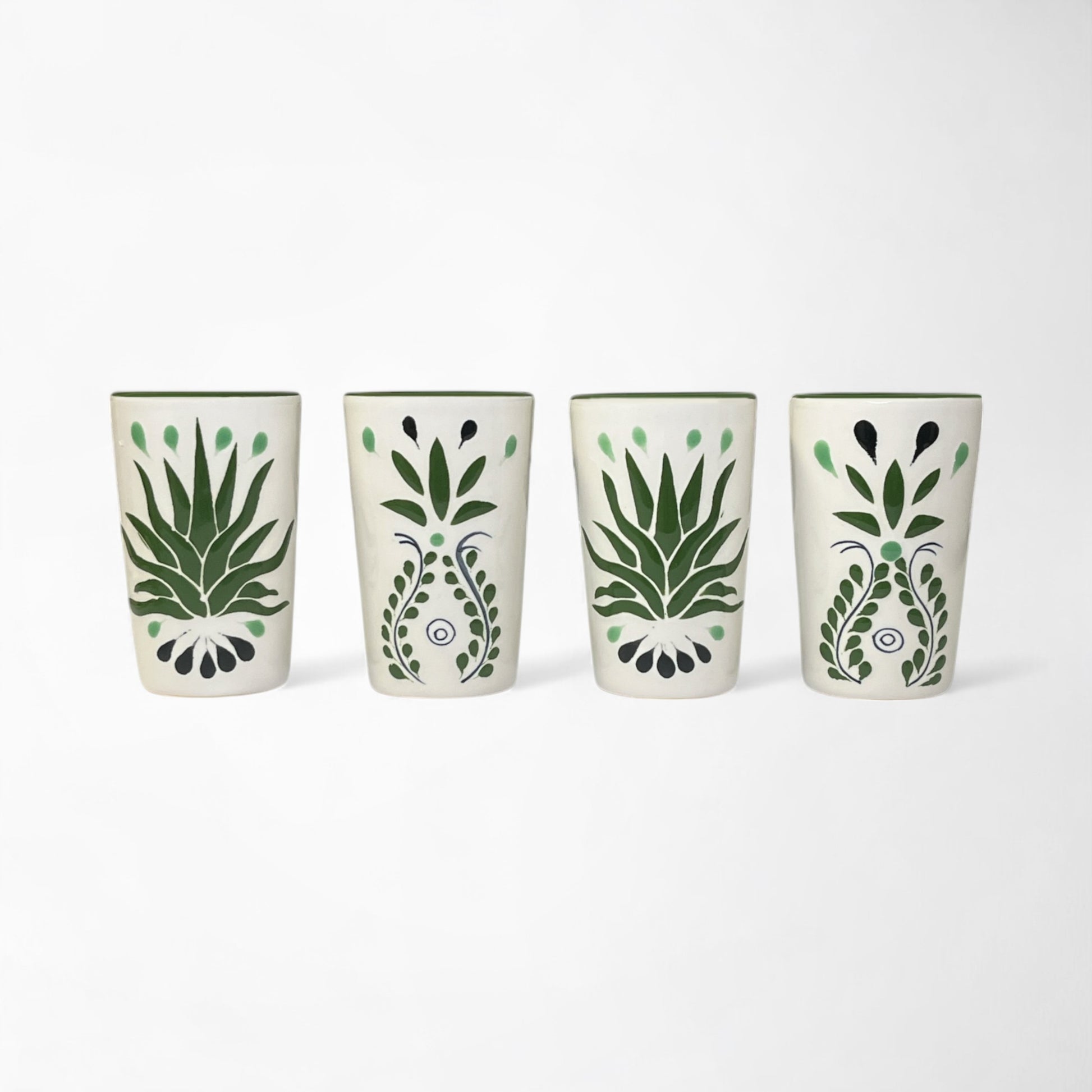 Artisan shot glasses with green agave design, handmade in traditional Talavera style